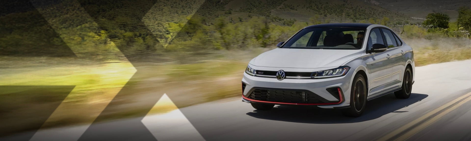 nexauto : Gray Volkswagen Jetta GLI driving on the road.