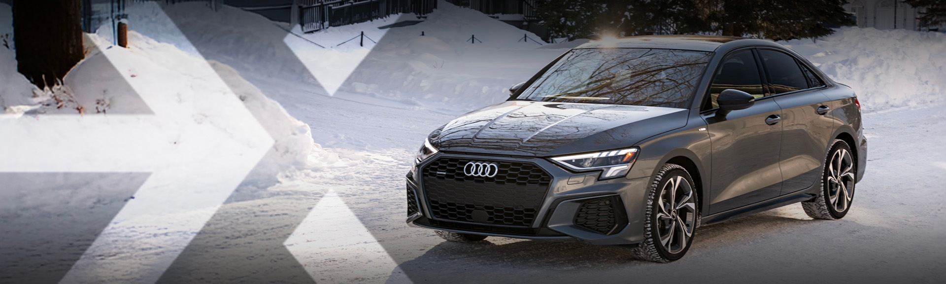 nexauto: Pre-Owned Grey Audi A3 viewed from the front left in a snowy setting.